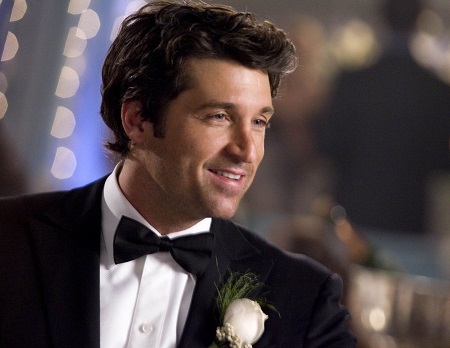 Patrick Dempsey in the movie 'Enchanted' wearing a suit before dancing with the lead character.